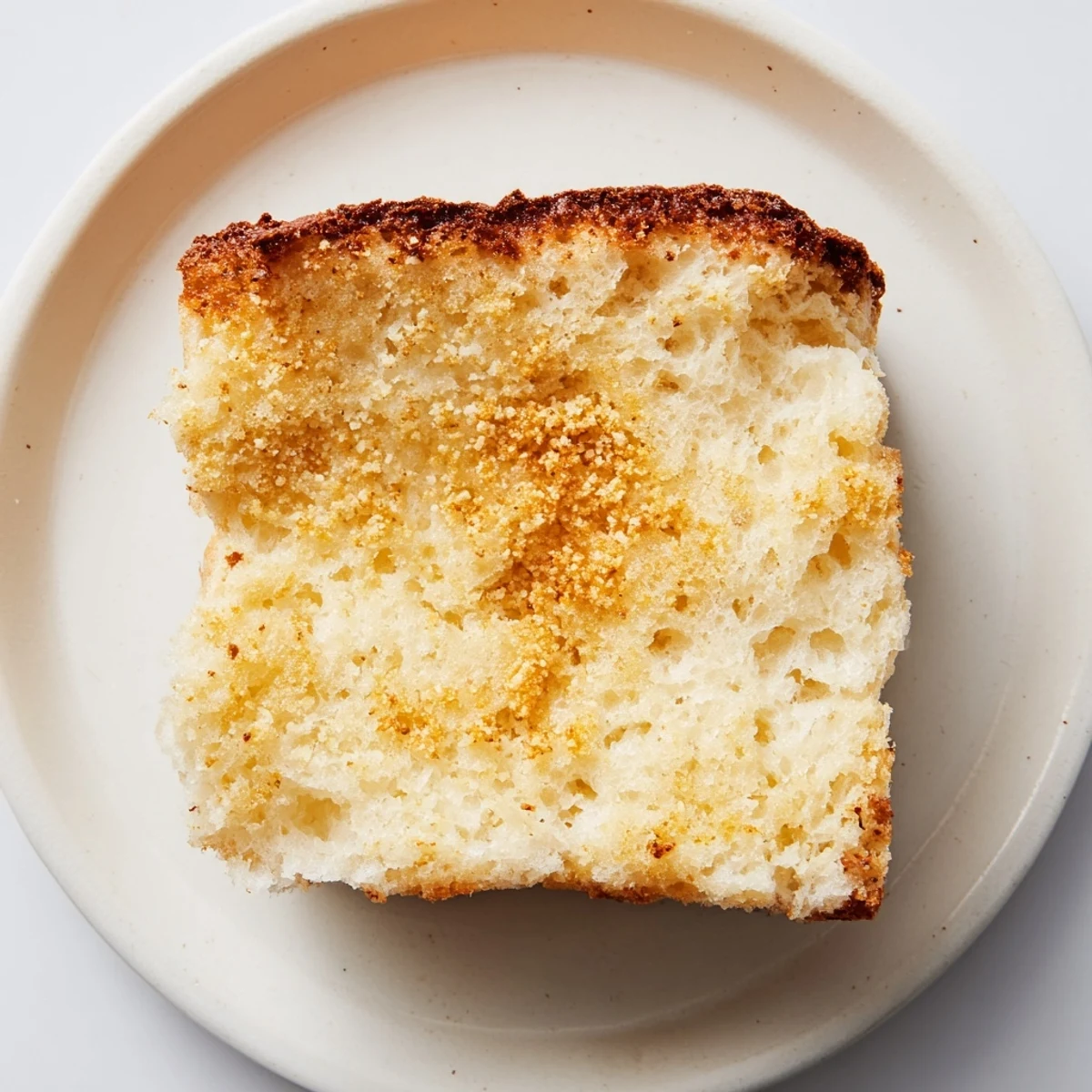 Sheet Pan English Muffins, a golden-brown baked batch, perfect for a cozy, delicious brunch.