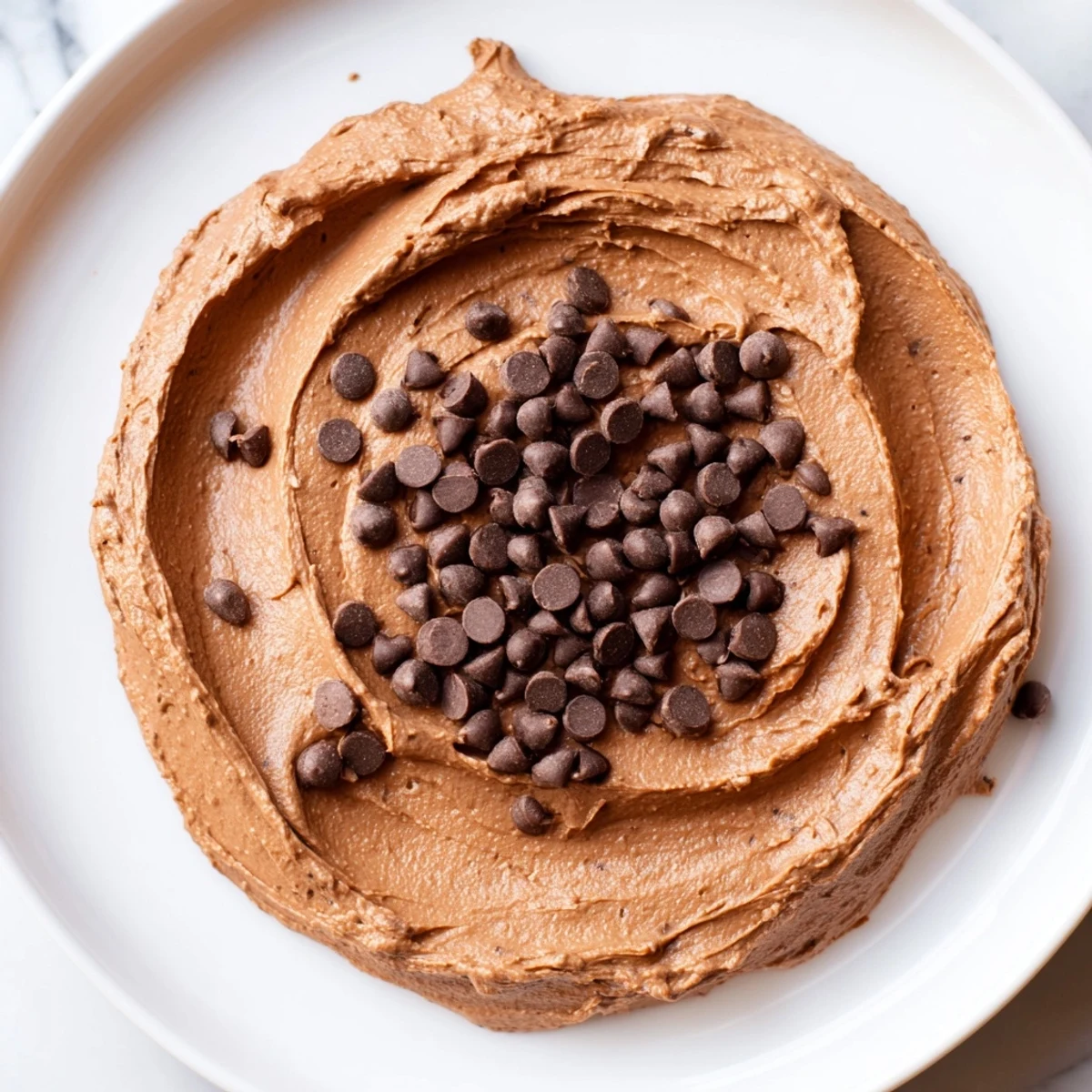 Indulgent gluten-free brownie batter dip served with apple slices, a perfect sweet treat everyone loves.