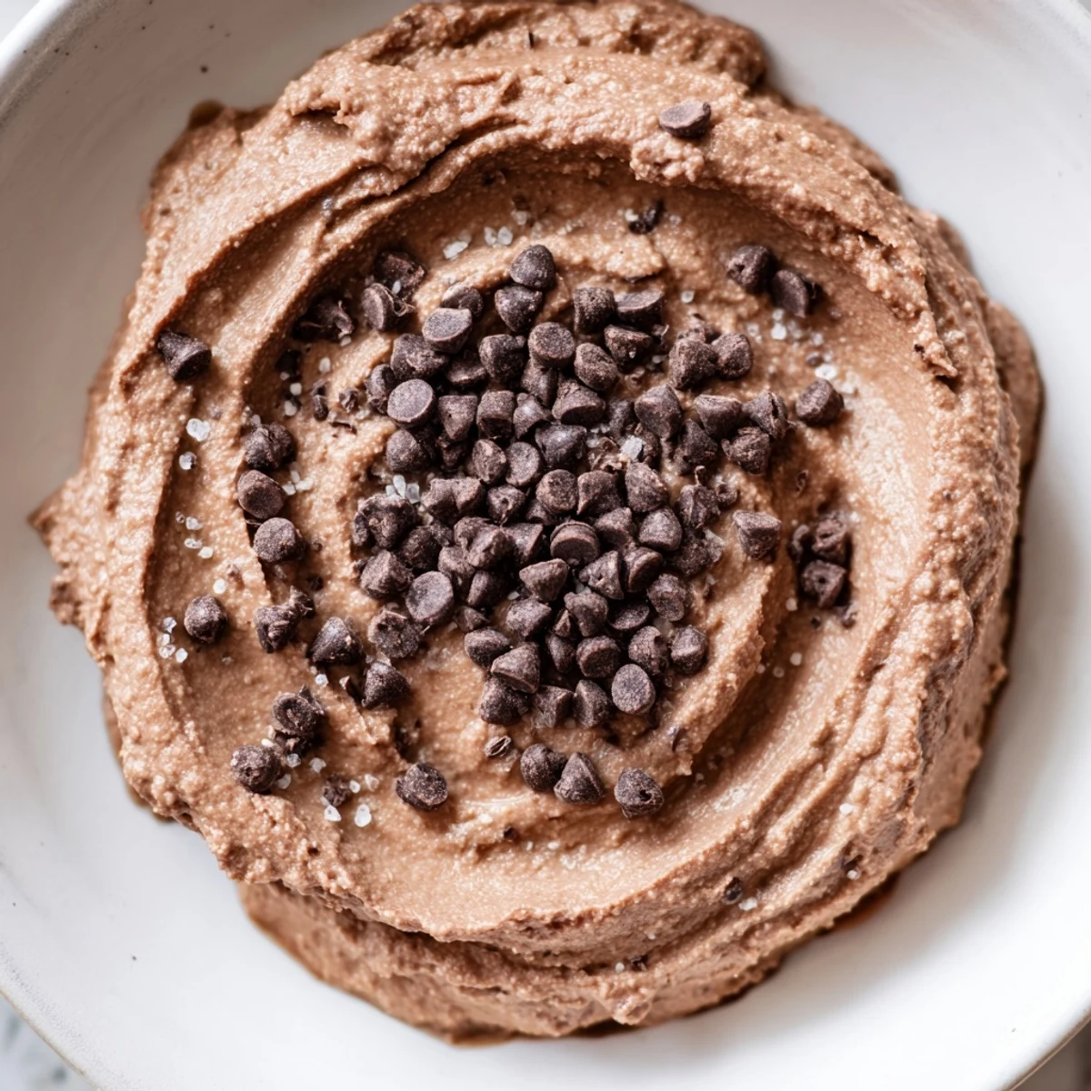 Rich, decadent gluten-free brownie batter dip, perfect for a party with fresh fruit and pretzels.