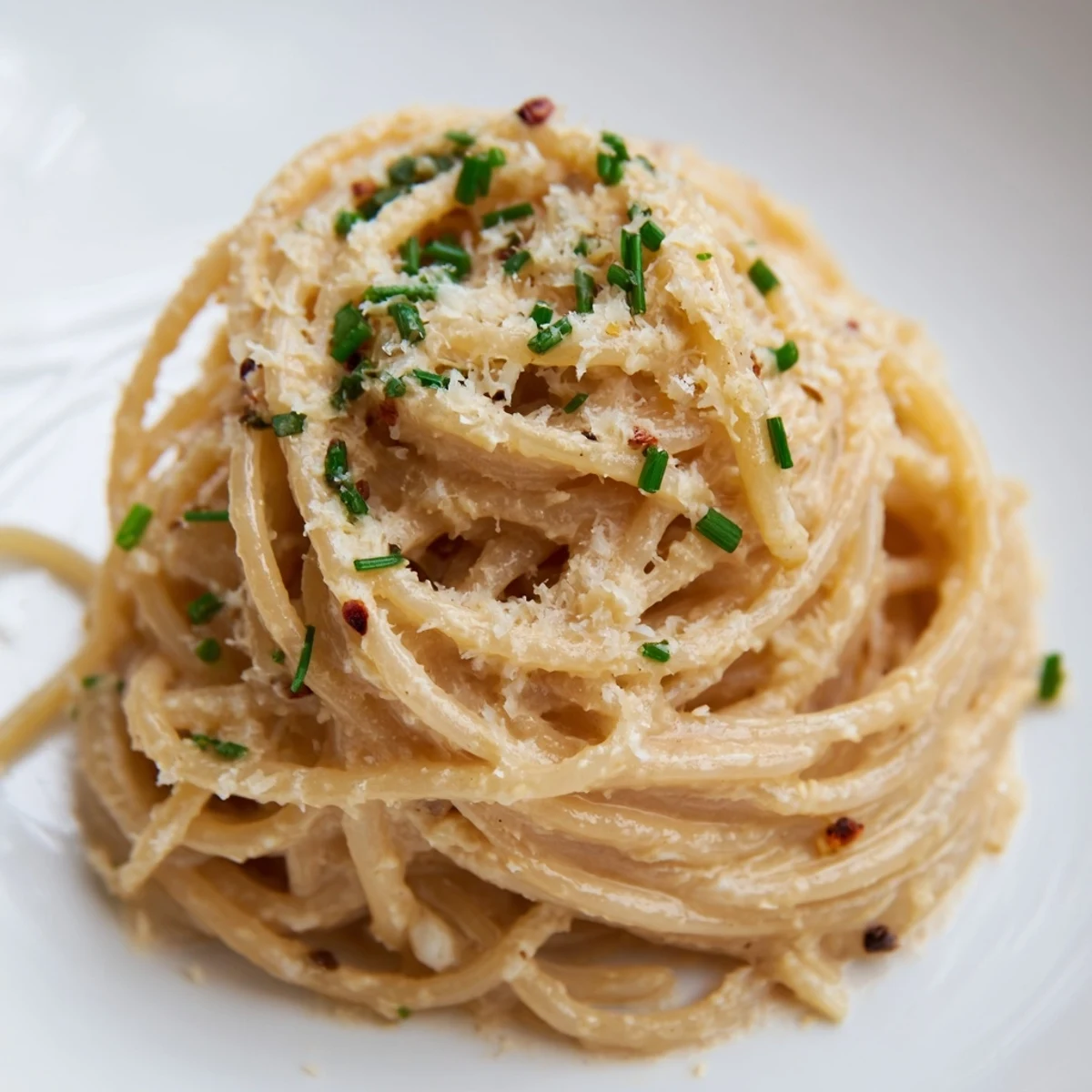 Silky strands of Miso Butter Pasta tossed in a creamy, savory sauce with garlic and Parmesan.