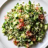 Close-up of a vibrant bowl of Lebanese Tabbouleh Salad, showcasing fresh herbs and lemon dressing.