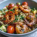 One-Pan Lemon Butter Shrimp and Orzo with juicy shrimp, bright lemon, and tender orzo in a single skillet.  