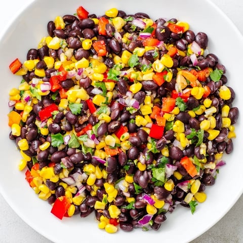 Freshly made Southwest Black Bean Salad with colorful peppers and a zesty lime dressing.