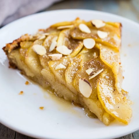 Homemade Rustic Crustless Apple Pie, ready to be enjoyed with a scoop of vanilla ice cream.