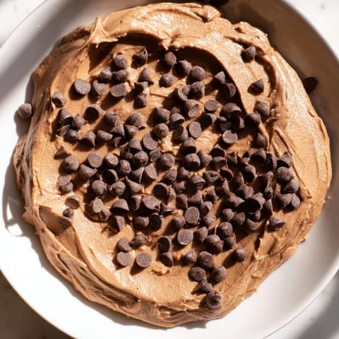 Creamy brownie batter dip with visible chocolate chips, a delicious gluten-free dessert ready to enjoy.