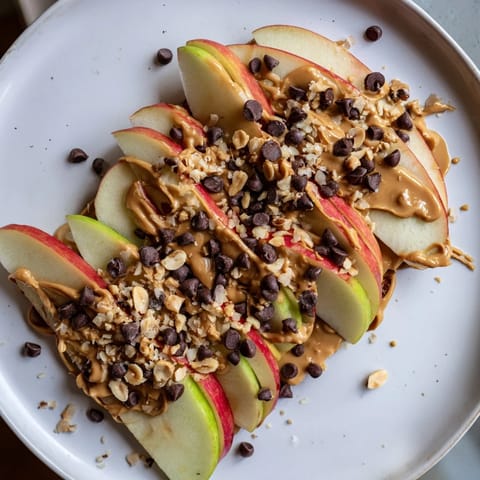 Drizzled peanut butter coats the fresh apple slices in these delicious Peanut Butter Apple Nachos.