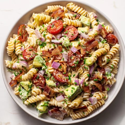 This BLT Pasta Salad features golden bacon crumbles, refreshing tomatoes, and flavorful creamy dressing.