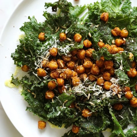 A close-up view of the warm Kale salad with crispy chickpeas, ready to enjoy as a meal.