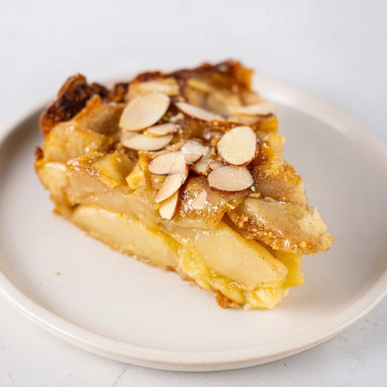 Freshly baked Rustic Crustless Apple Pie, featuring sweet apples in a creamy custard base.