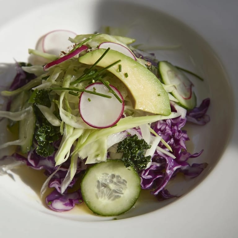 Vibrant Green Goddess Detox Cabbage Salad, tossed in zesty dressing, ready for a healthy meal.
