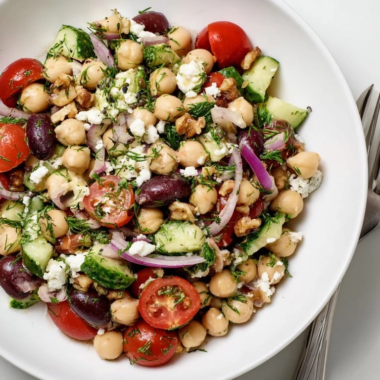 Hearty Dense Bean Salad with chickpeas, cherry tomatoes, and a creamy, sleep-promoting cherry dressing on top.