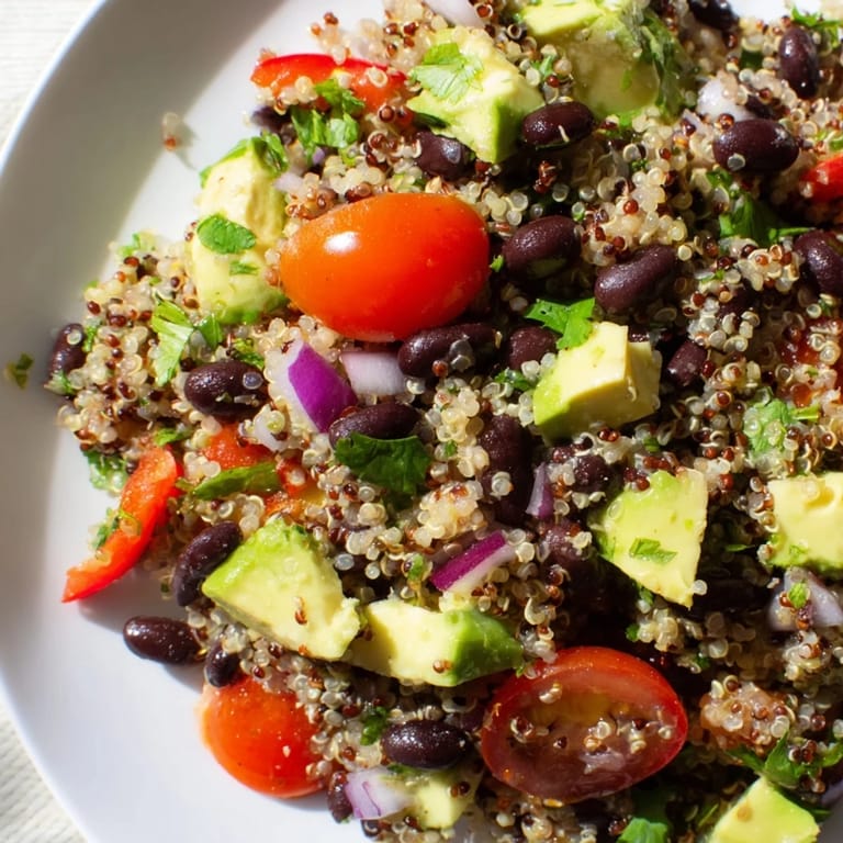 Chilled, delicious Quinoa Black Bean Salad featuring plump black beans and a tangy lime dressing.