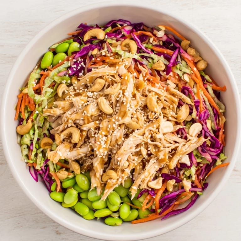 Tossing Edamame Crunch Chicken Salad with fresh ginger dressing for a high-protein, dairy-free lunch or light dinner.