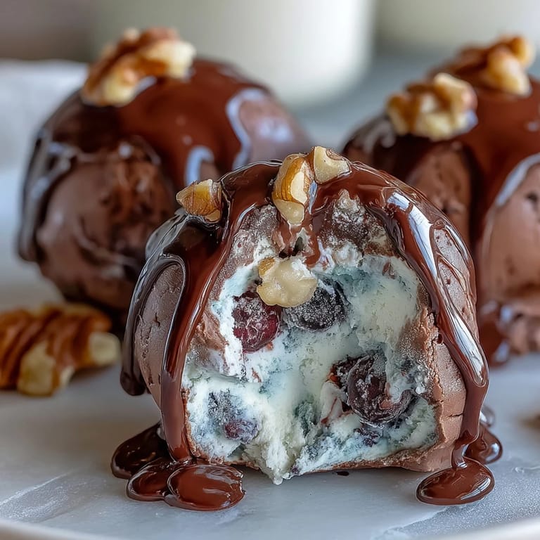 Creamy vanilla Greek yogurt mixed with fresh blueberries and crunchy walnuts, frozen and dipped in smooth dark chocolate.  
