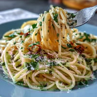 Bright Spring Pasta Limone with silky lemon-butter sauce, fresh basil, and parmesan.